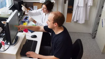 College members performing research in a laboratory